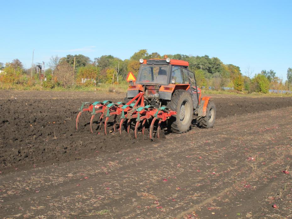 Tractor with subsoiler performing tillage